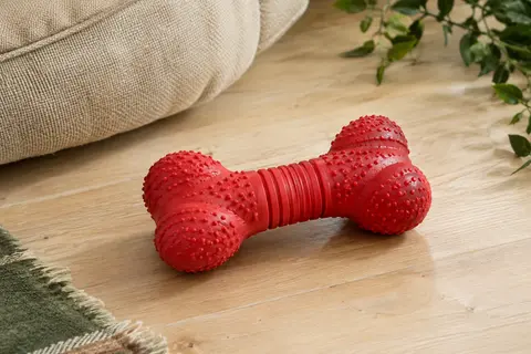 Jouet à mâcher rouge en caoutchouc naturel, en forme d’os avec reliefs et rainures